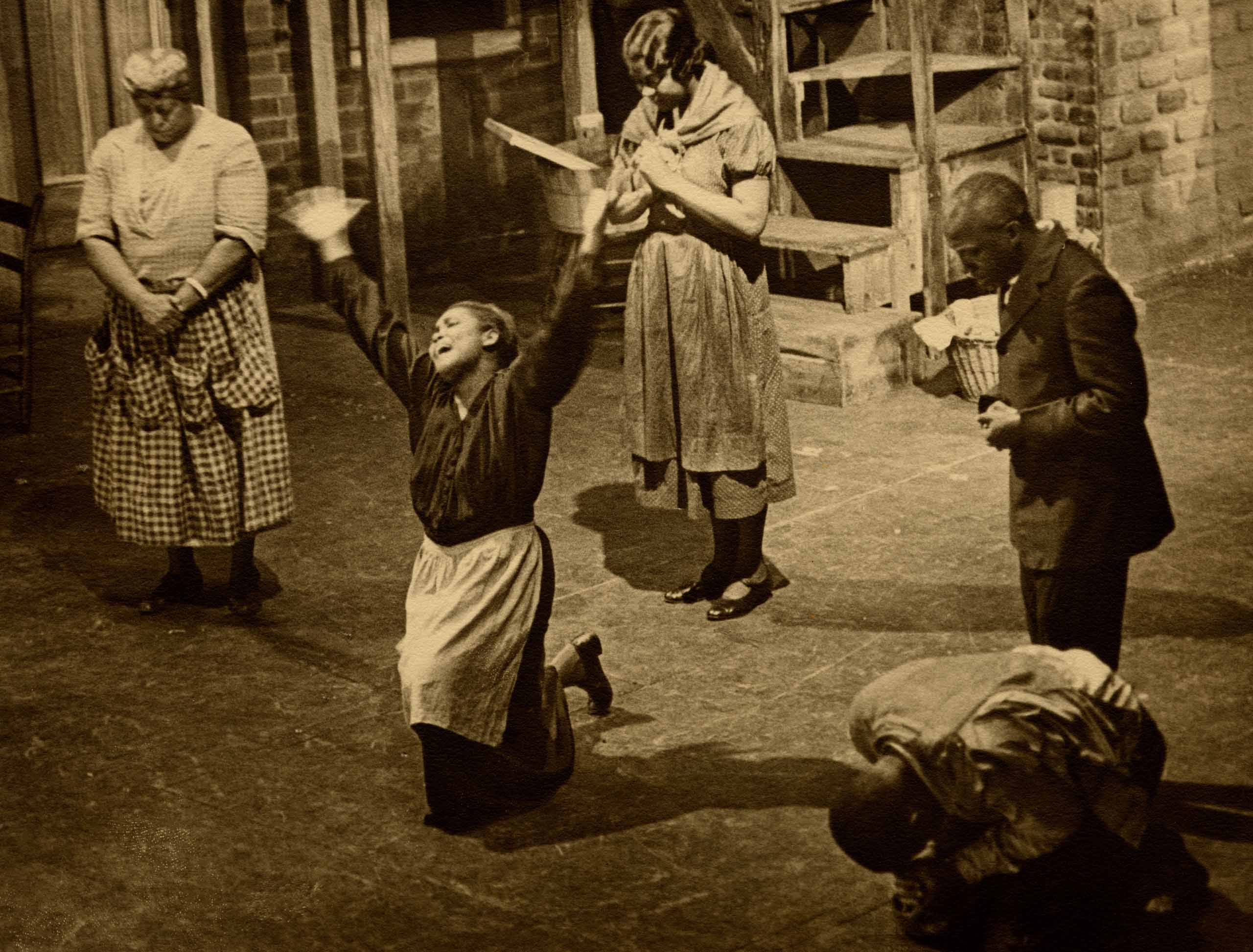 Ruby Elzy as Serena, on her knees and raising her arms, in Porgy and Bess. Pre-Broadway tryout, Colonial Theatre, Boston, 1935. Photo by Richard Tucker.