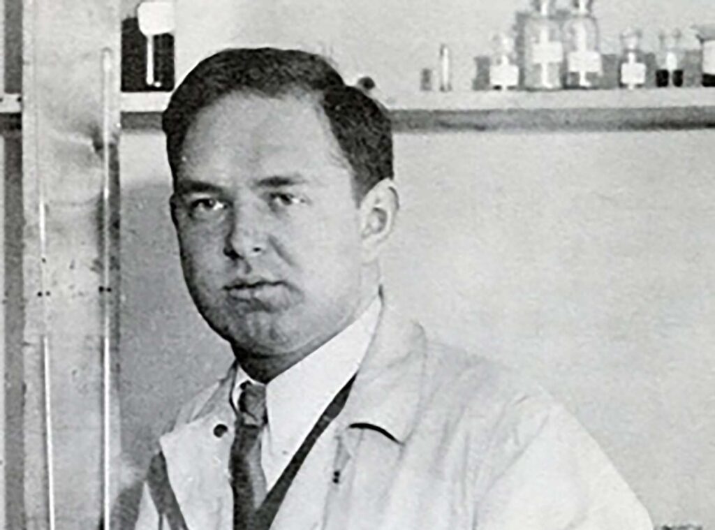 Leopold Godowsky Jr. in a lab coat.