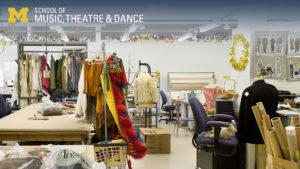 Zoom background, Walgreen Drama Center costume shop showing fabric, workstations, and costumes