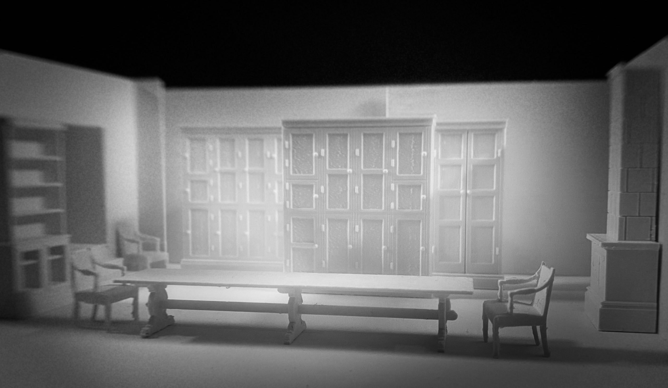 Scenic design for Miss Julie featuring a large dining table with one chair at each end