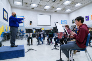 Parker Middle School band teacher Jeff Stimson conducts his 8th grade band students in Revelli Hall’s rehearsal space.