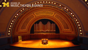 Zoom background, Hill Auditorium stage with organ console centered, view from the audience