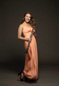 Jillian Kouzel - Earl V. Moore Award for Music holding her oboe