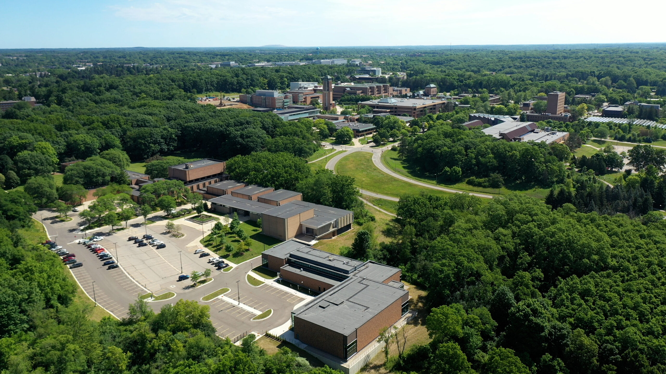 An aerial view of the University of Michigan's North Campus highlighting the new Dance Building, the Earl V. Moore Building, and the wider North Campus community