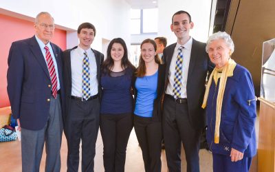 Six people pose together standing at SMTD