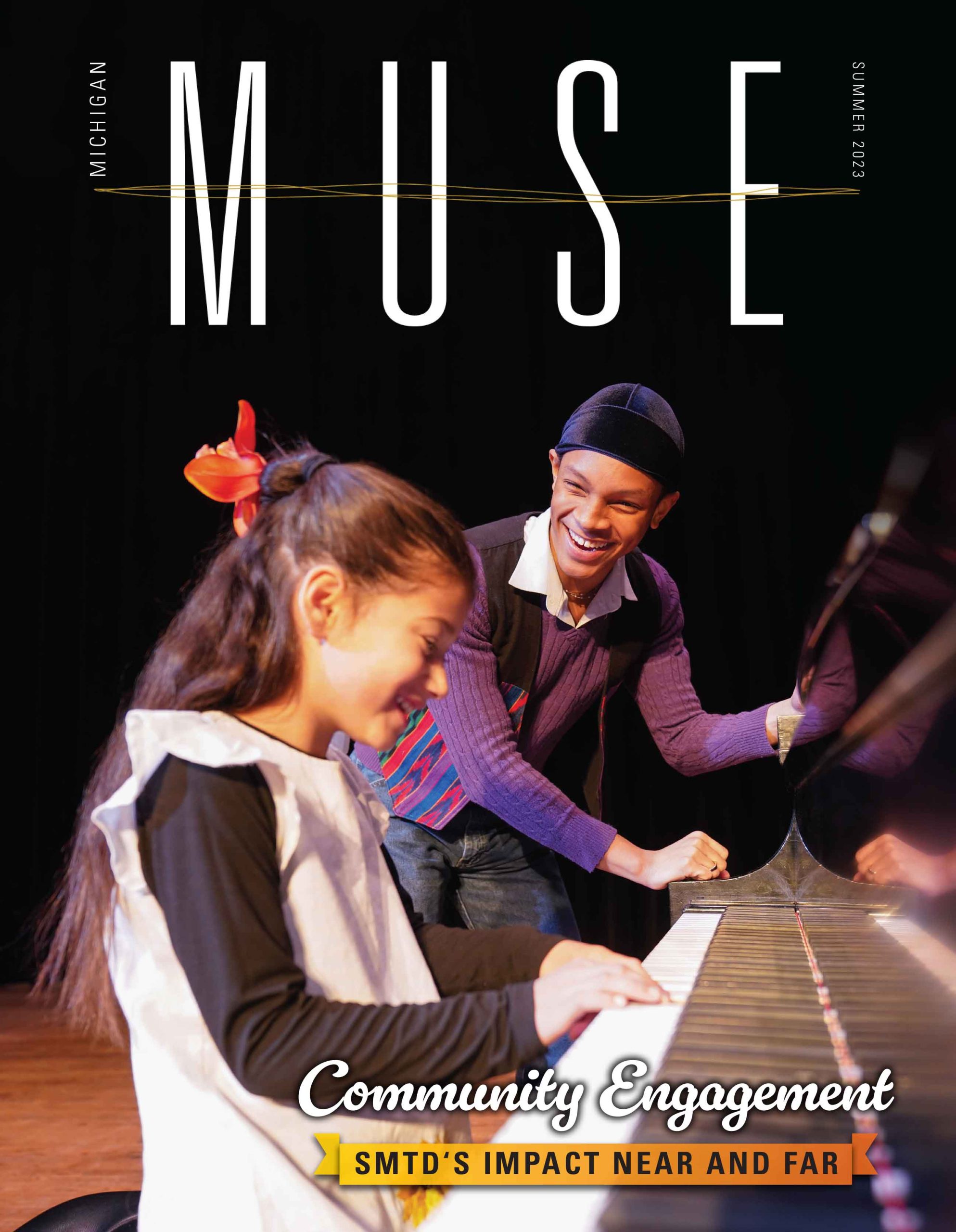 Print cover for Michigan Muse Summer 2023 - A college student and a young student work together at a piano