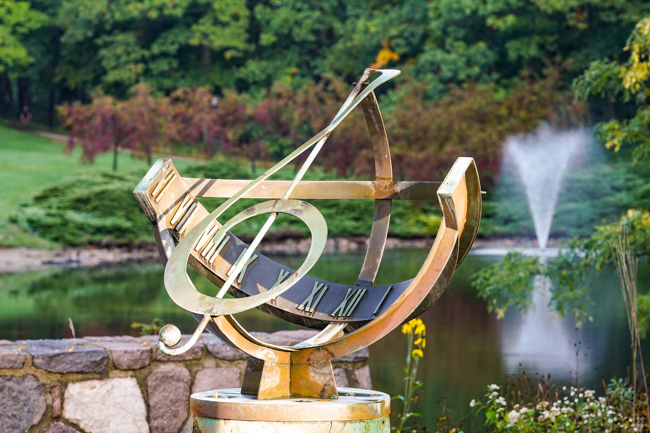 A treble clef sculpture next to the SMTD Pond