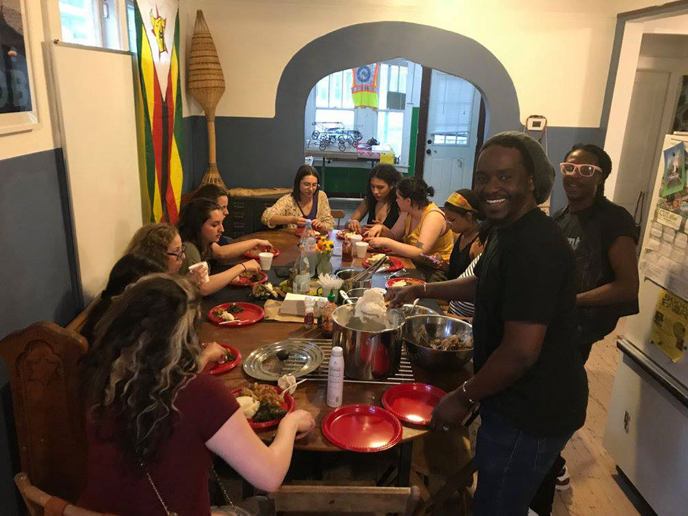 Graduate certificate students gathering for a potluck dinner together