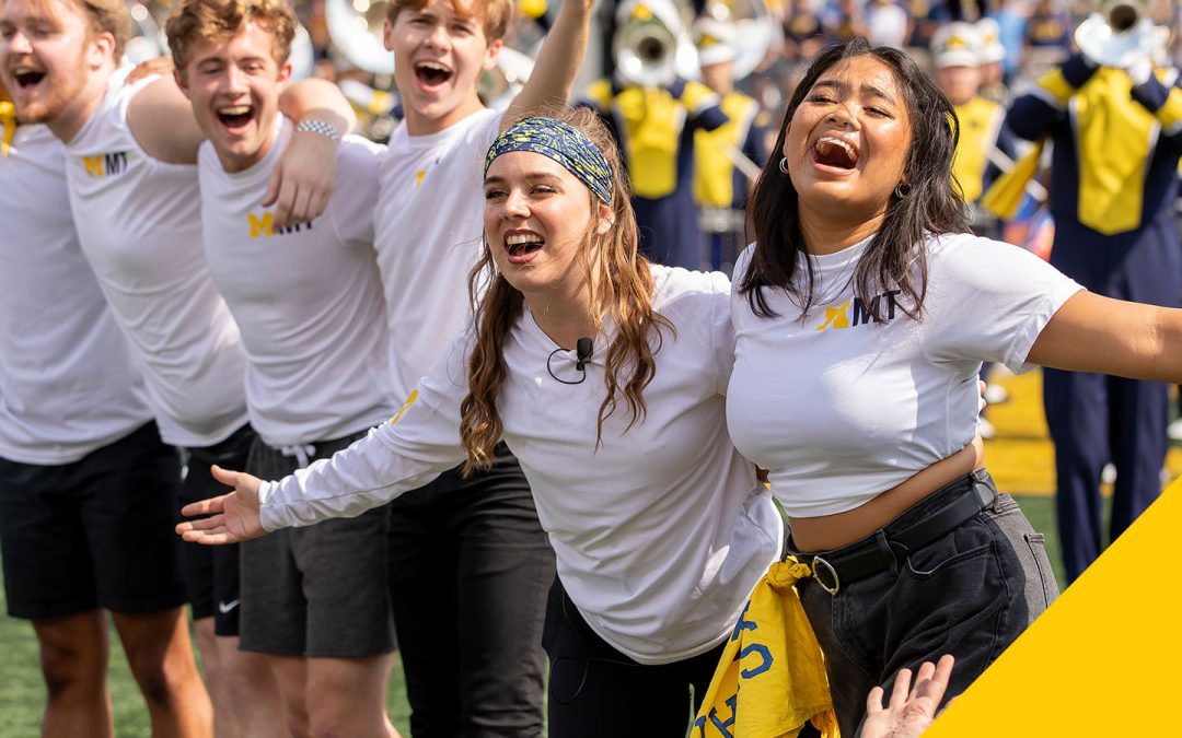 musical theatre students performing with the Michigan Marching Band