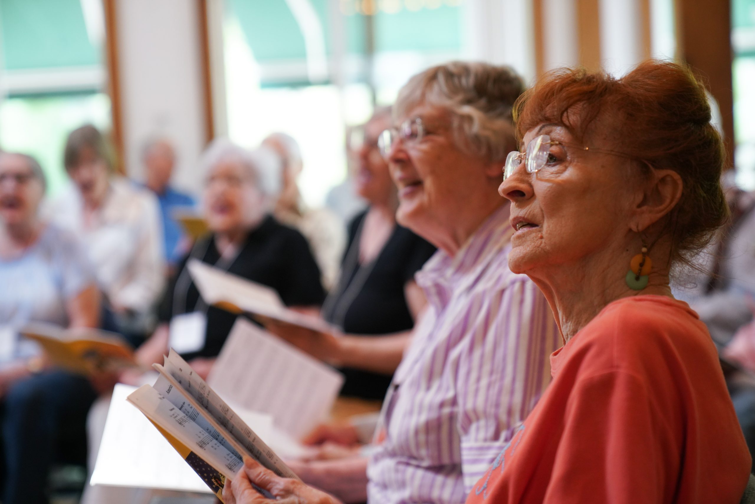 Voices Valiant members sing in rehearsal