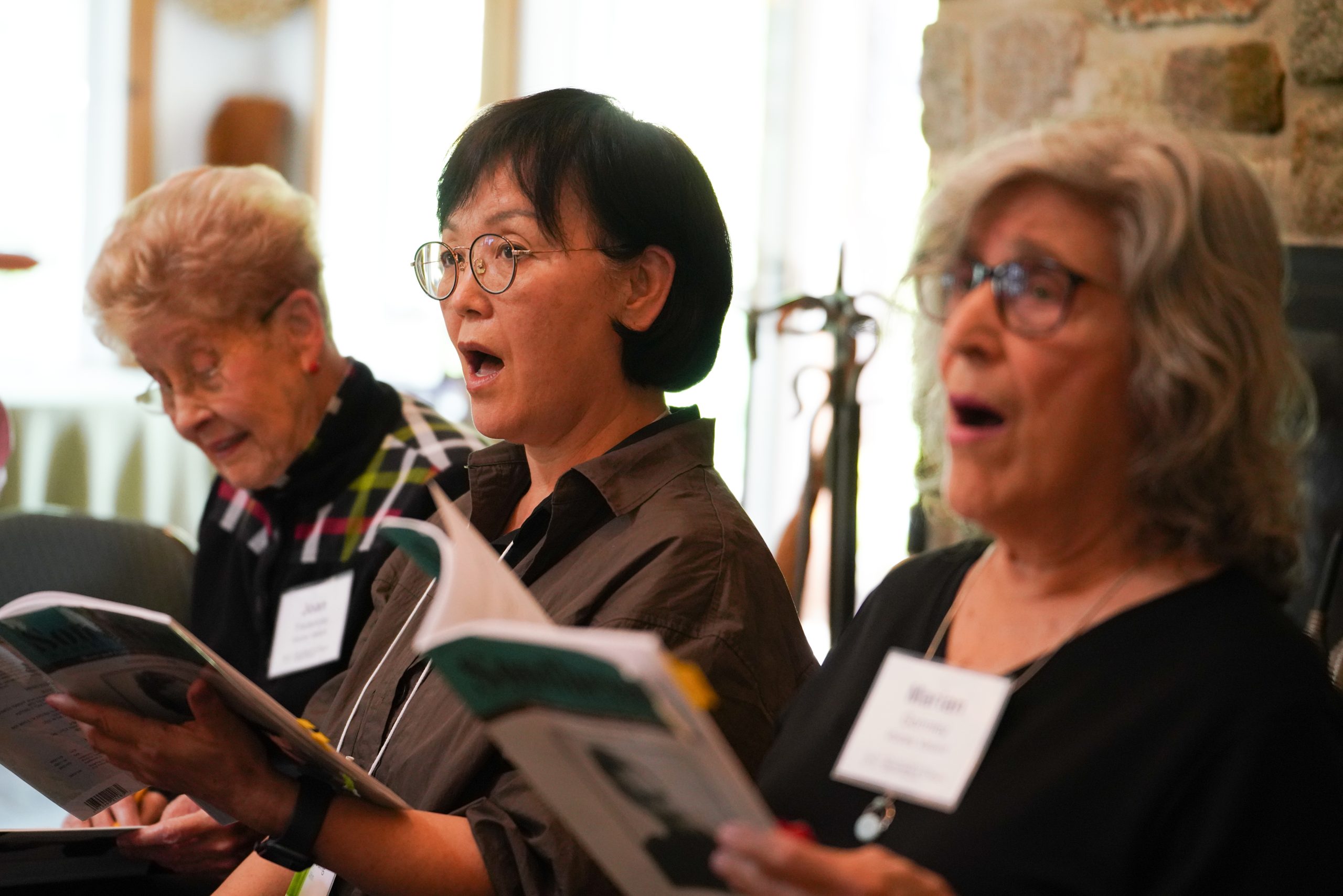 Voices Valiant members sing in rehearsal