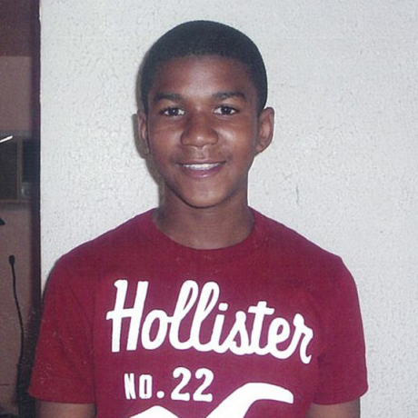 Portrait of Trayvon Martin wearing a red Hollister t-shirt.