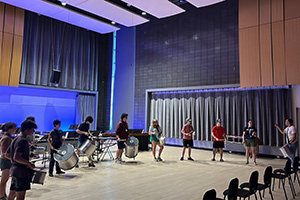 MPulse percussion students play together in an arc