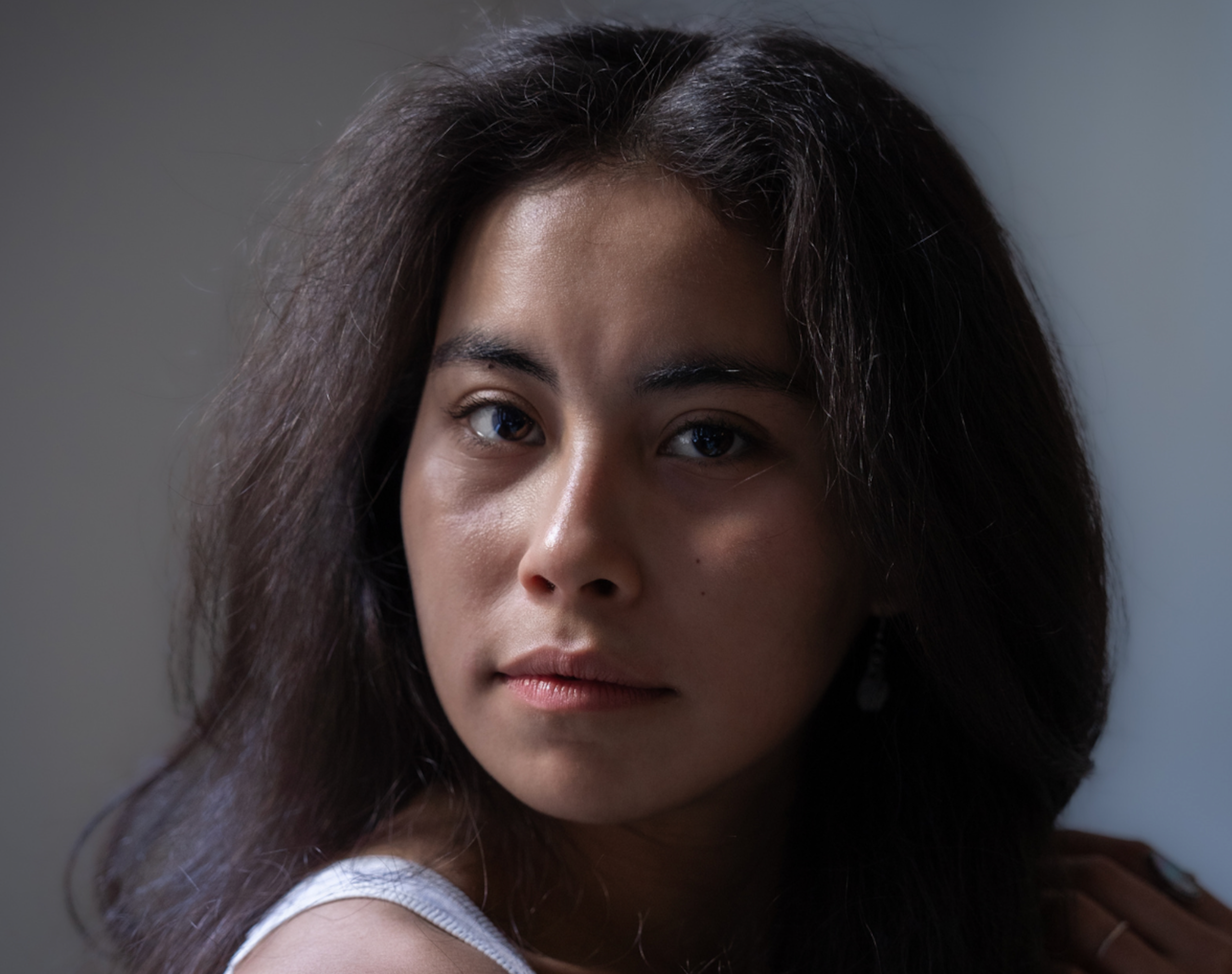 Headshot of Cyrie Topete against a gray background