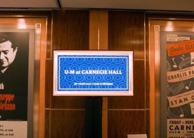 A blue sign reads "U-M at Carnegie Hall"