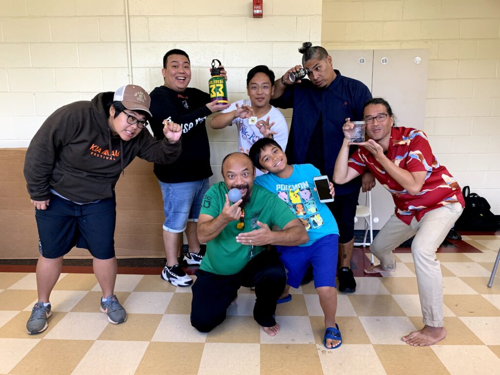 Group kneeling to pose