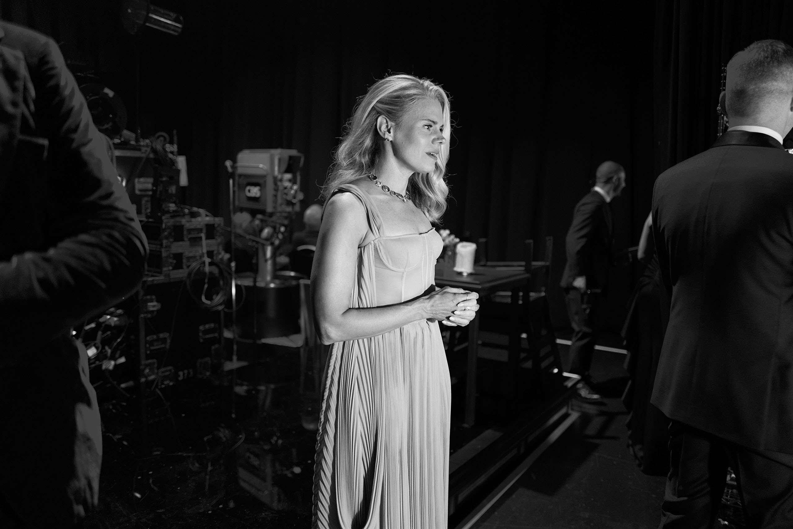 Celia Keenan-Bolger backstage at Radio City Music Hall 2025 Isabelle Stevenson Tony Award Photo Jenny Anderson Candid greyscale photo of Celia Keenan-Bolger standing in a formal gown in a backstage space.