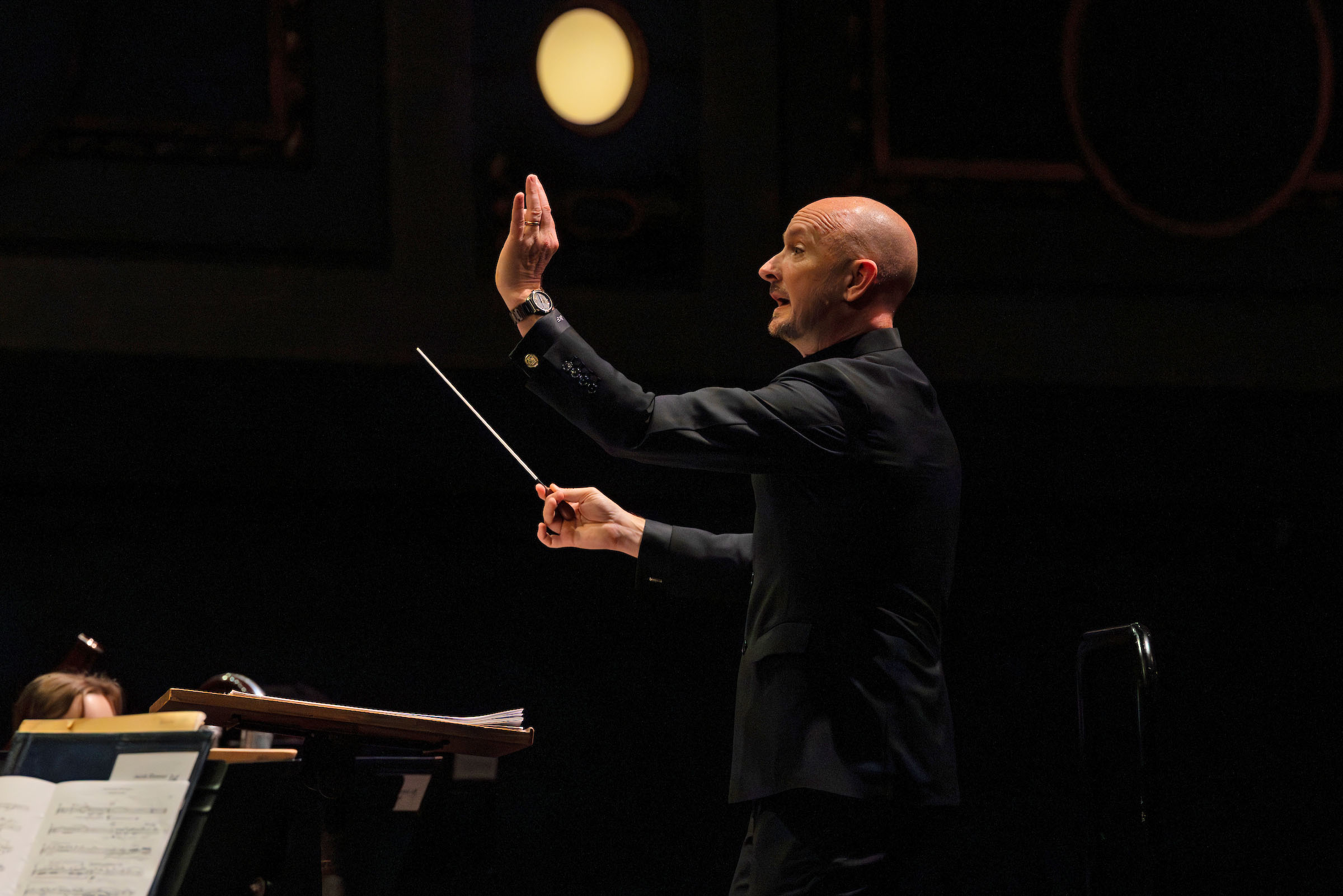 Jason Fettig conducts an ensemble in Hill Auditorium.
