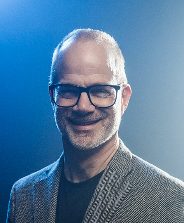 Studio portrait of Kipp Koenig with soft lighting.