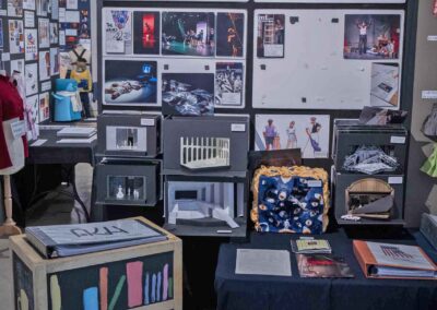 Aiden Heeres’s technical design display featuring props, scenic models, and production photos.