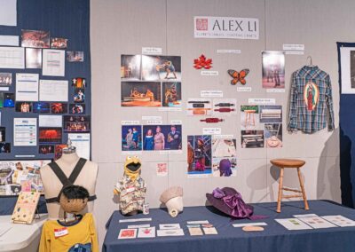 Alex Li’s display featuring costuming examples and production photos.