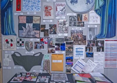 Amber Walters’s display featuring art pieces, production photos, and stage manager materials.