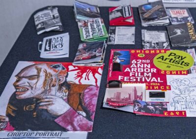 Spread of Walters's art prints, including a poster from the 62nd Ann Arbor Film Festival.