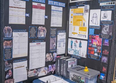 Chloe Deutschman’s display of run sheets, production binders, and production photos.