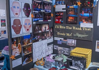 Gretchen Brookes’s display of sketches, production photos, and costuming samples.