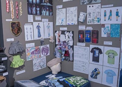 Illiana Beauchamp’s display of costume sketches, photos, and samples.