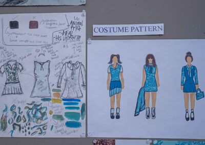 Side by side of Beauchamp’s costume sketches and final concept drawings.