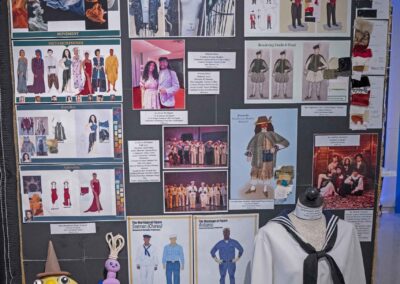 Sammer Ali’s display of costume sketches and photos.