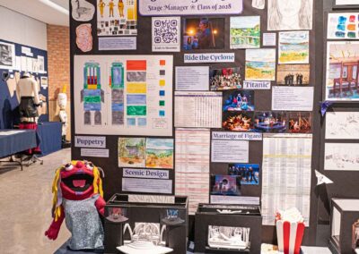 Sarita Gankin’s display featuring sketches, set models, and production photos.