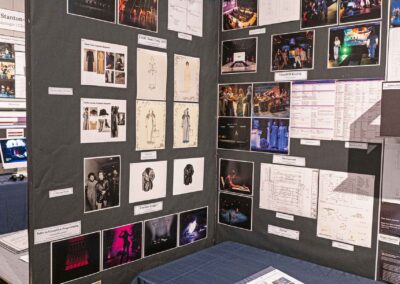 Shelby Holloway’s display featuring costume sketches, line notes, and production photos.