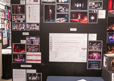 Tate Zeleznik’s display featuring lighting plan sheets and production photos.