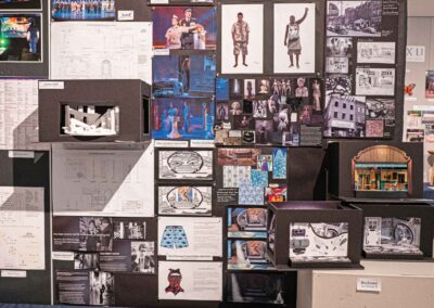 Yuchen Ma’s display featuring costume sketches, set models, and production photos.