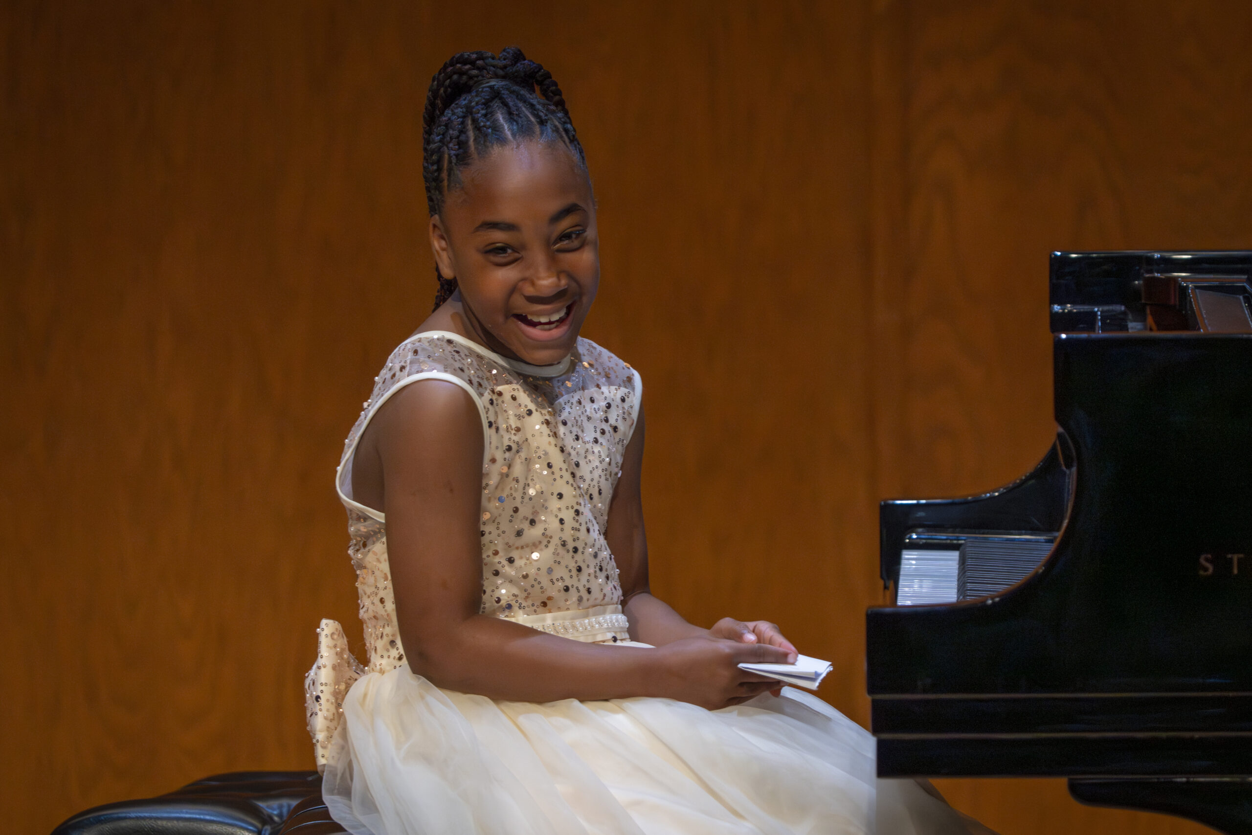 Our Own Thing student sitting at the piano