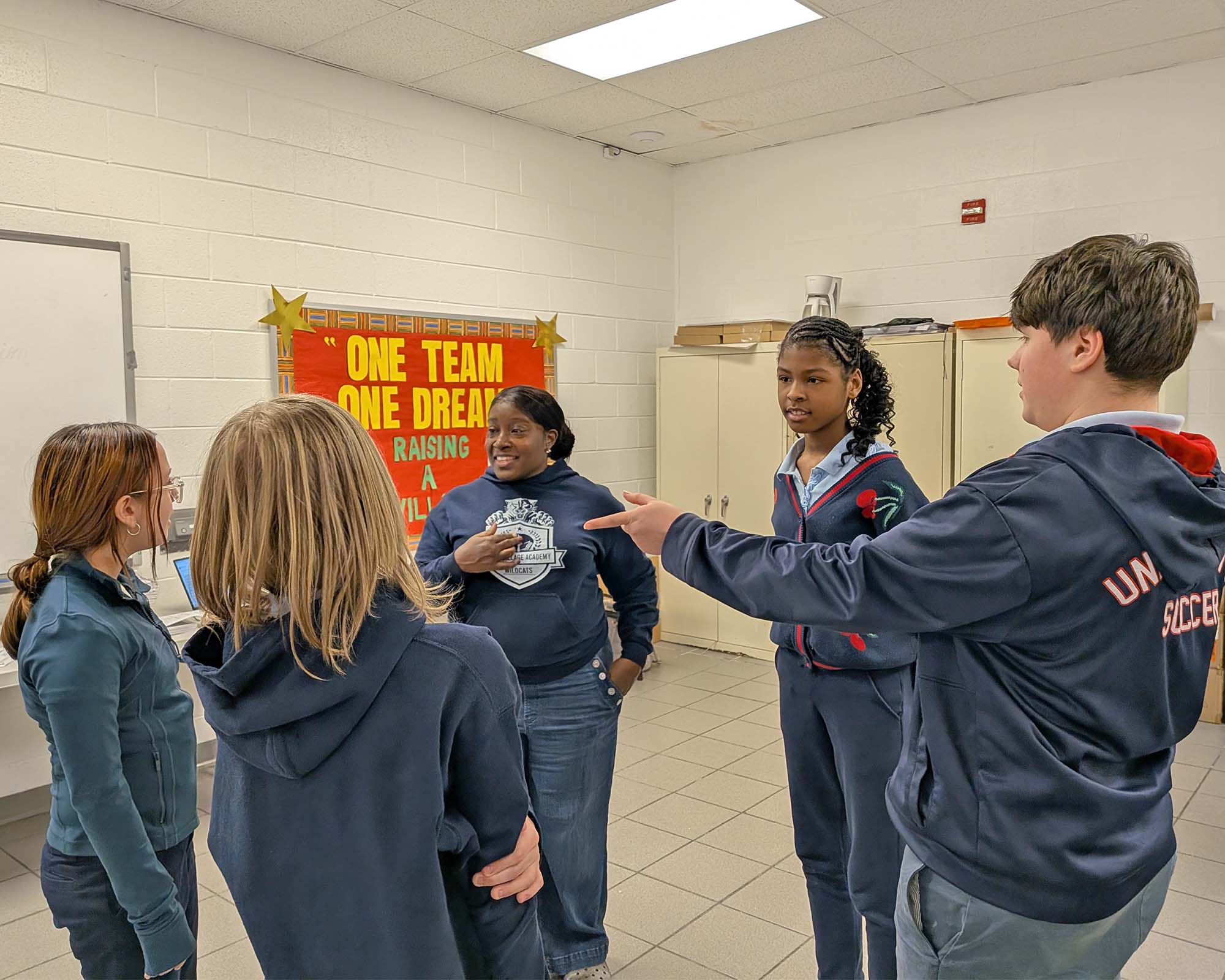 First Act Second Act Michigan Community Programs Middle school students stand in a circle, engaging with an instructor.