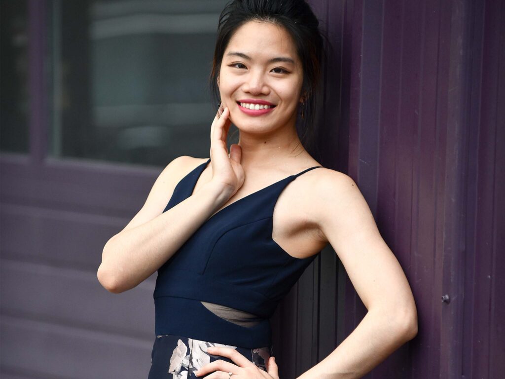 Standing studio portrait of Tzu-Yin Huang.