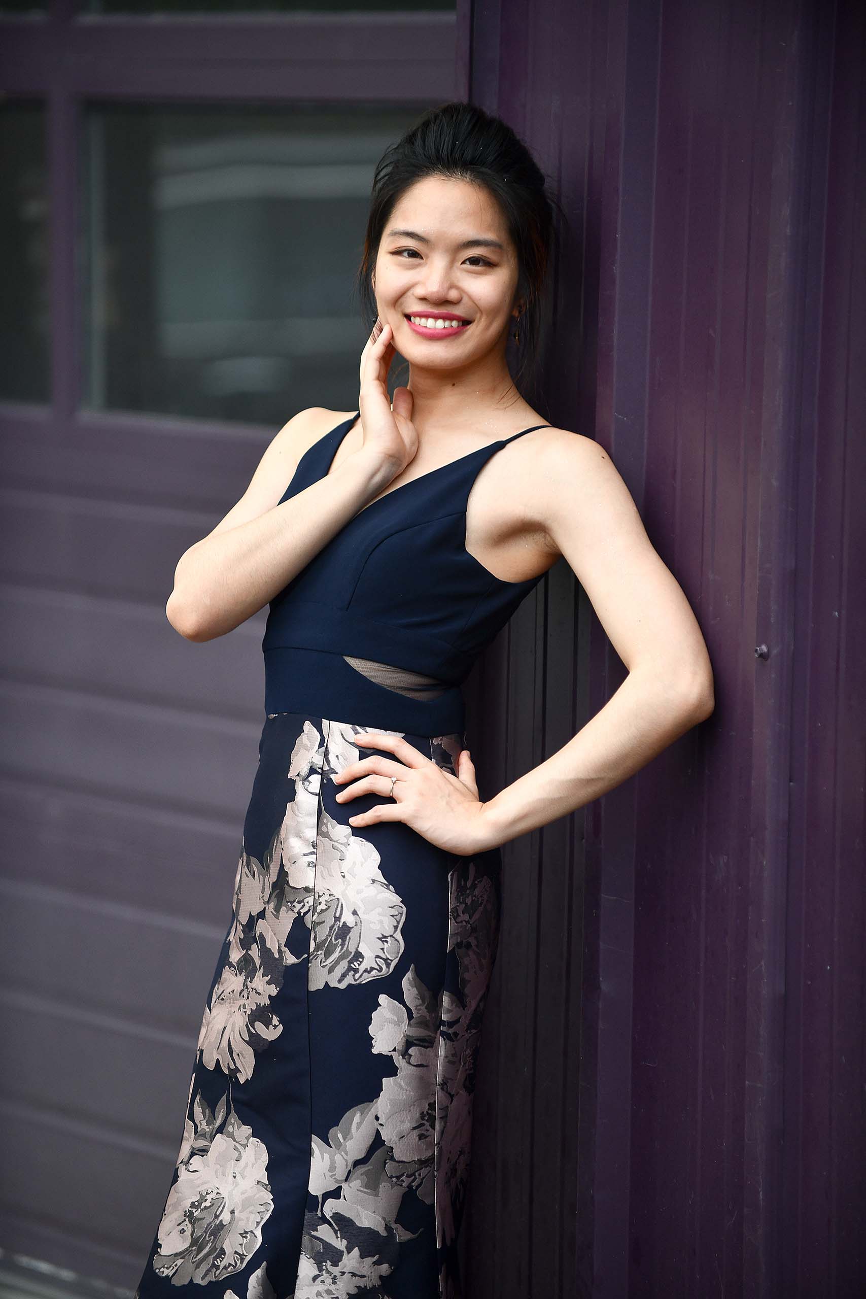 Standing studio portrait of Tzu-Yin Huang.