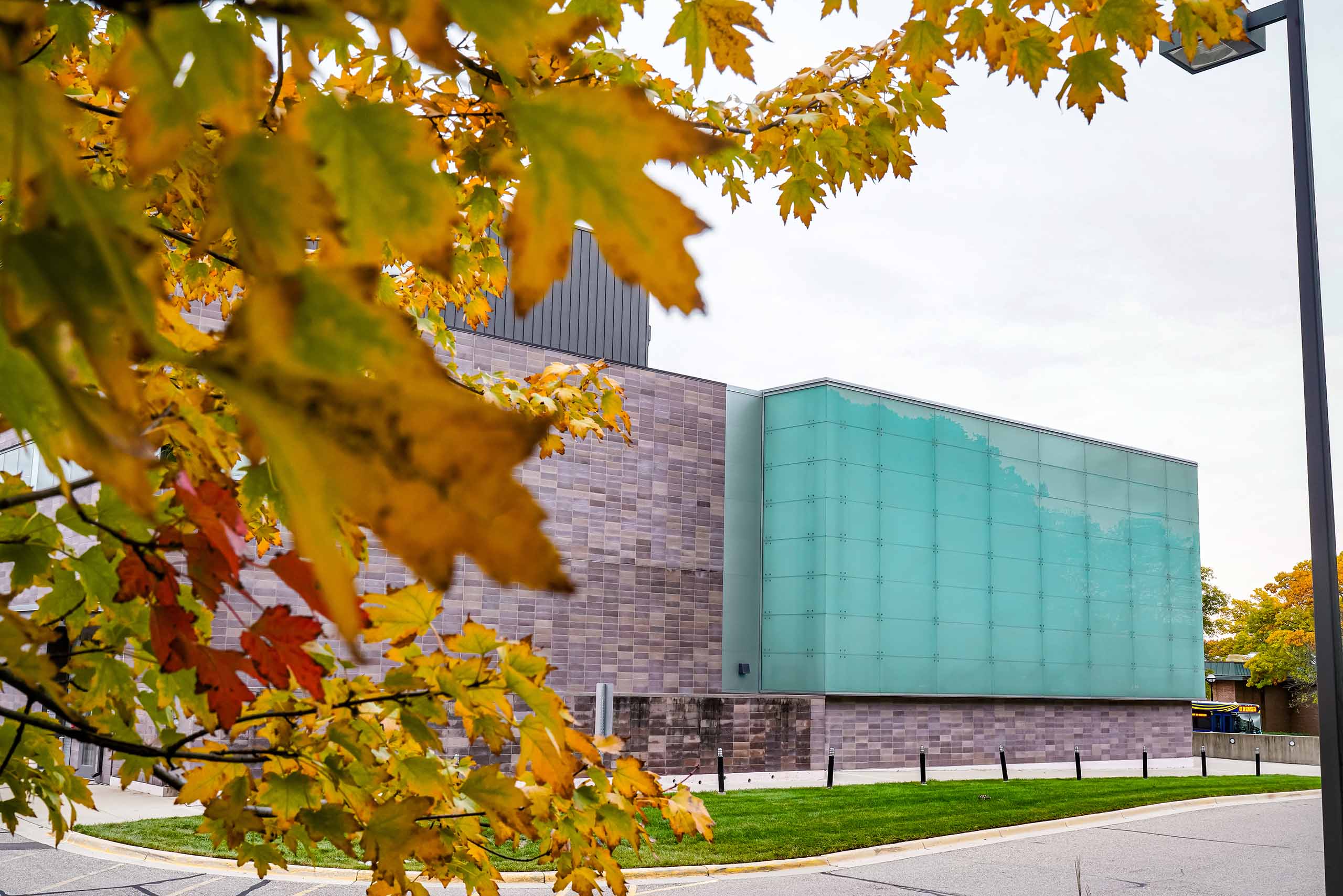 Walgreen Drama Center with colorful fall leaves.