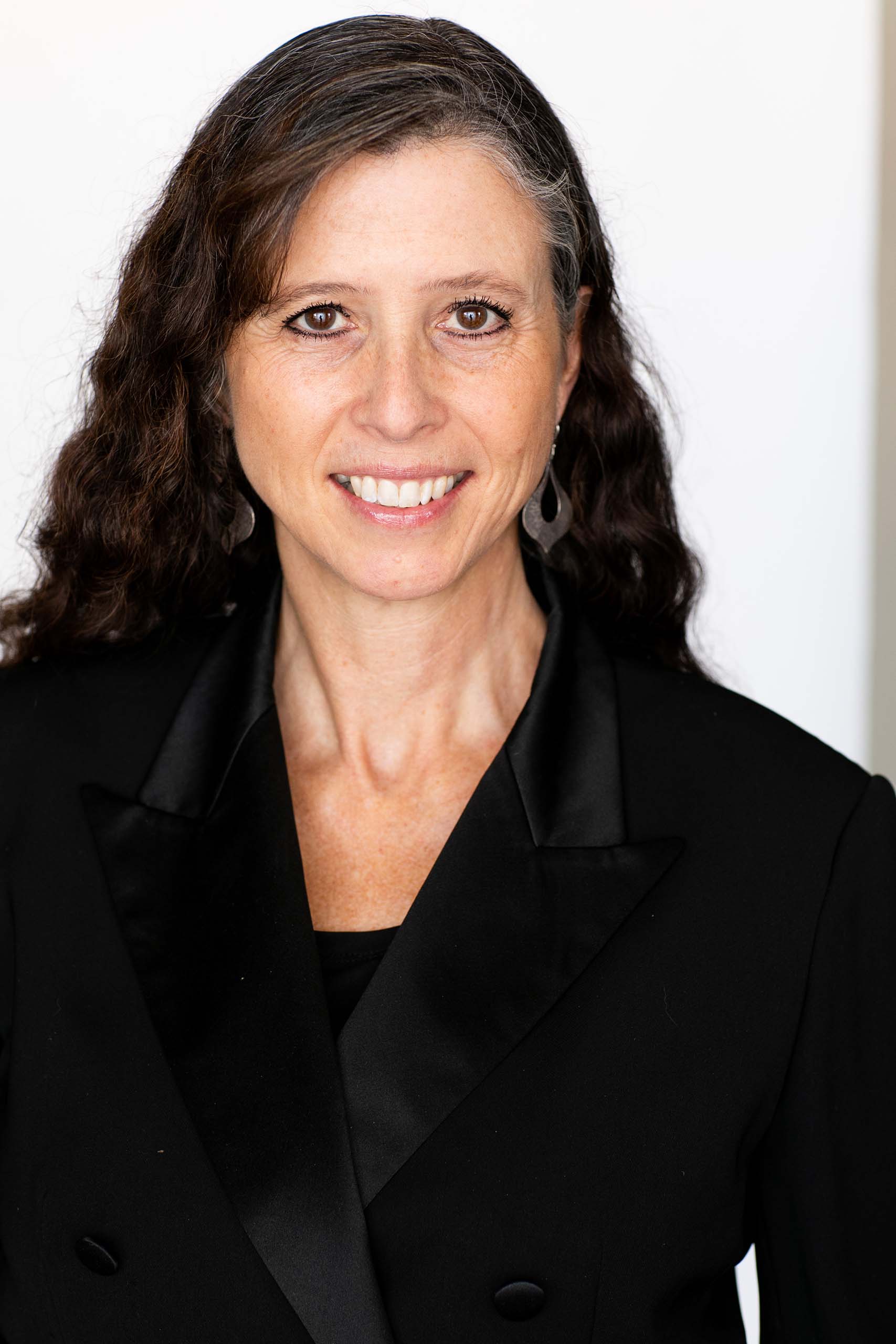 Studio portrait of Elizabeth Schauer attired in a black blouse.