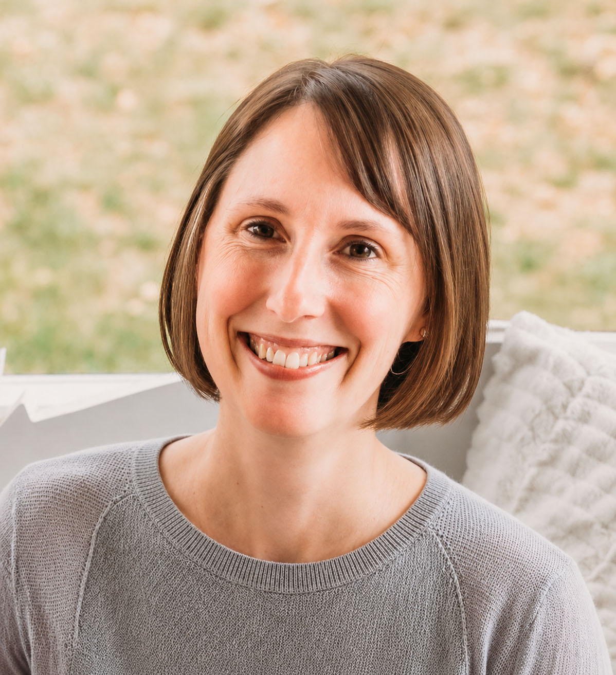 Casual portrait of Gretchen Platt-Koch wearing a grey sweater.