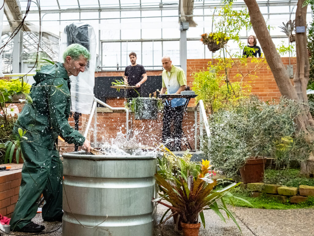 Michael Gould (right) performs a work by Raven Chacon with members of the Living Earth Show in March 2019