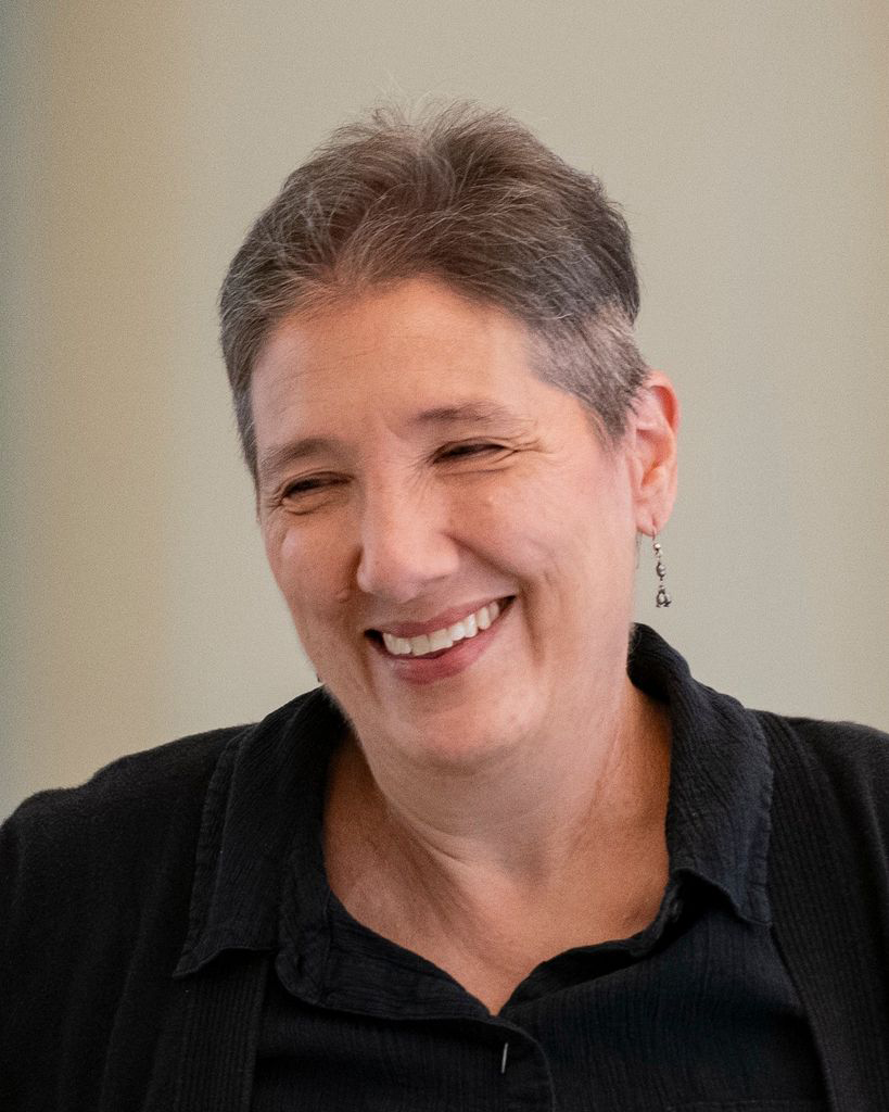 Candid headshot of Ruth Leney-Midkiff smiling.