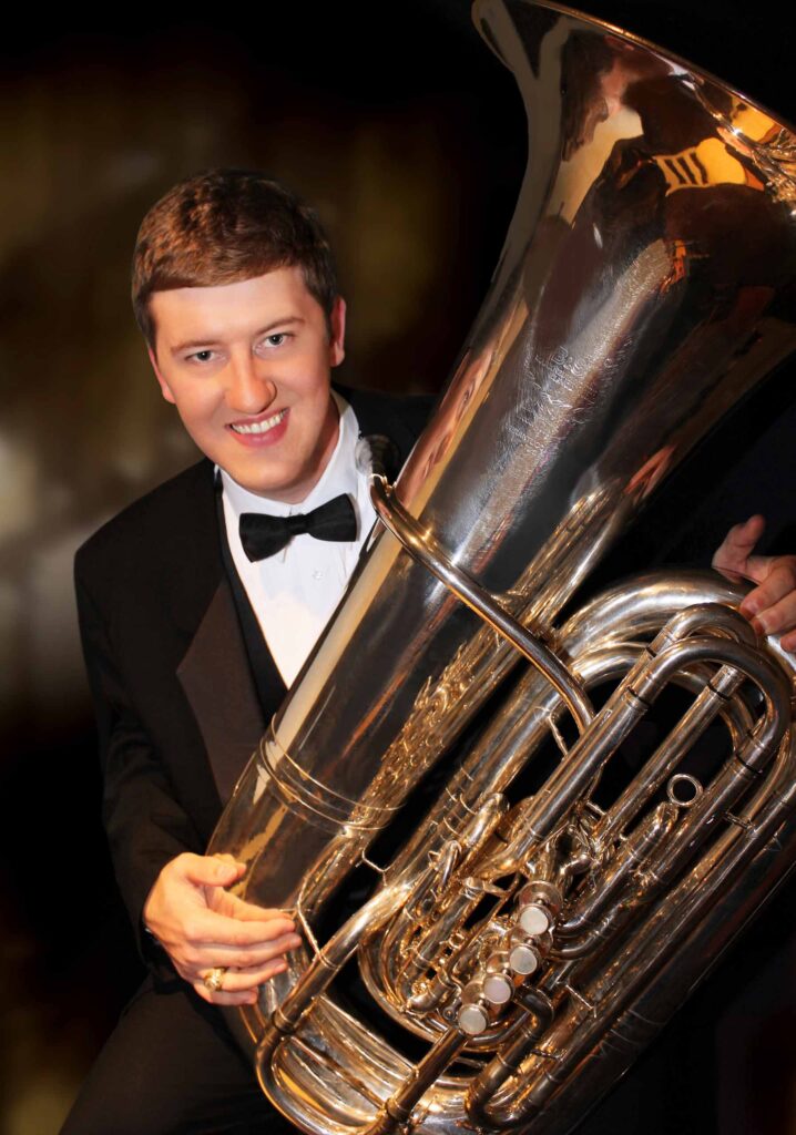 Formal portrait of Andy Smith with his tuba.